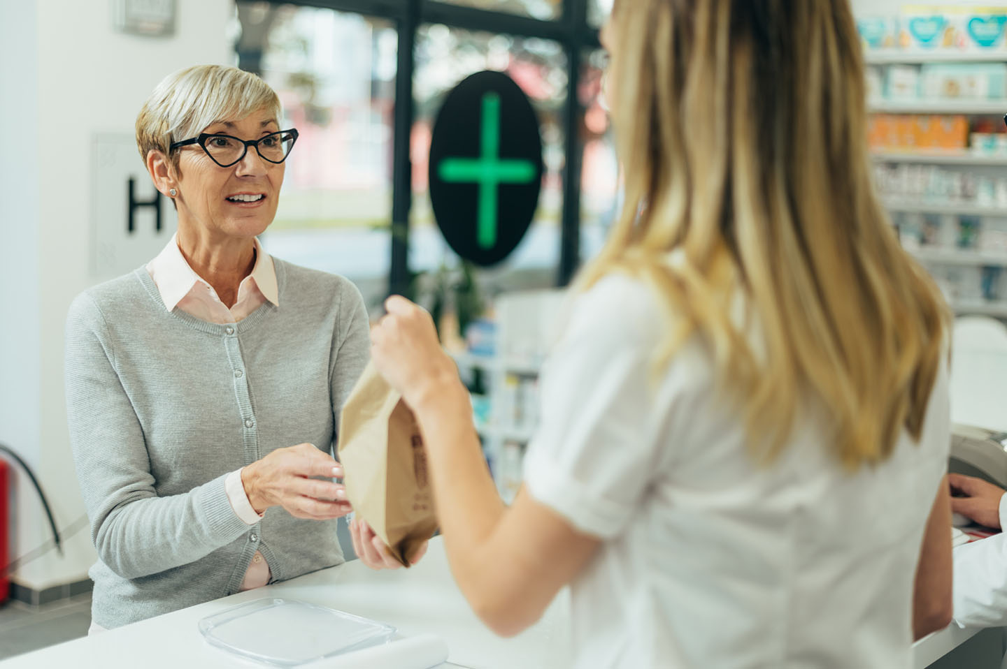 Woman collecting a prescription