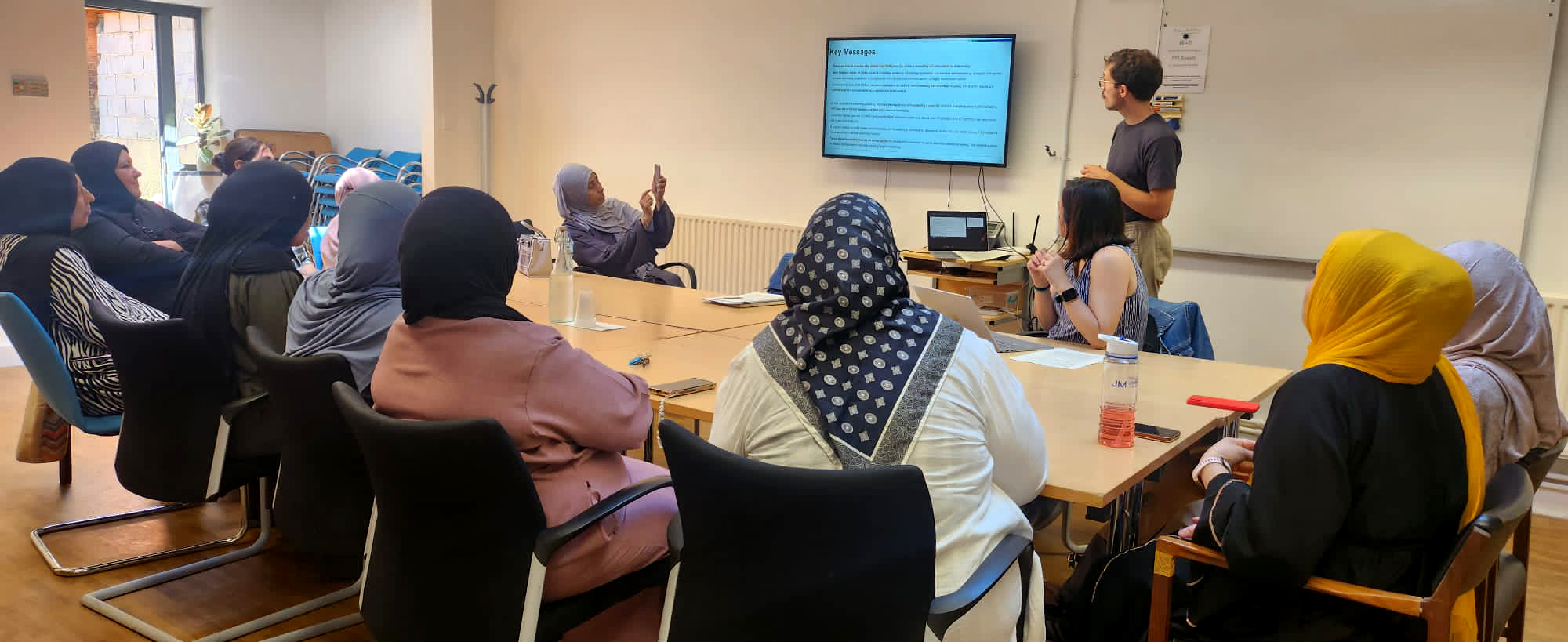 Presentation to a group of women wearing headscarves