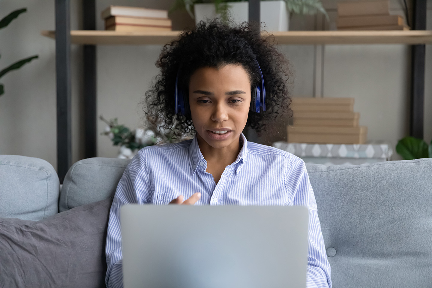 Woman in headphones on a webcam call