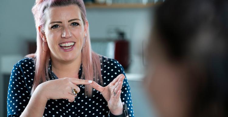 Two women having conversation using sign language
