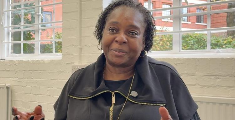 Director from Choices CIC sitting in front of a window