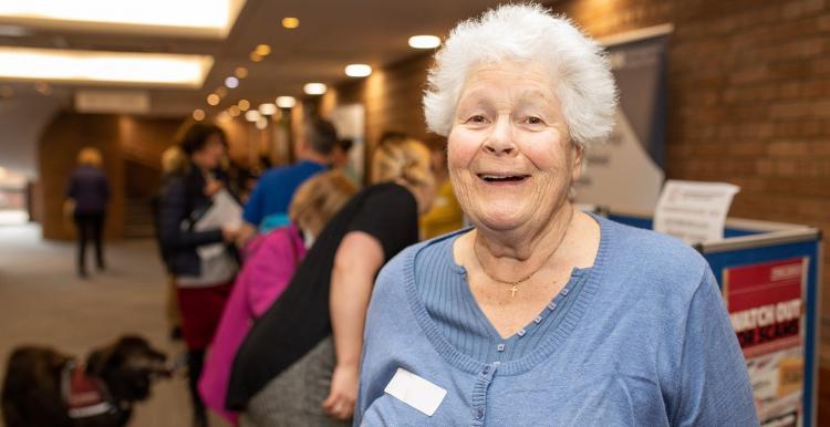 Smiling woman at a meeting