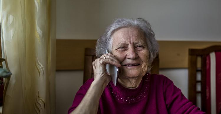 Elderly woman talking on the phone