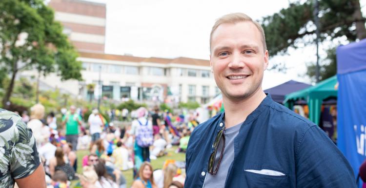 Smiling man at an outdoor event