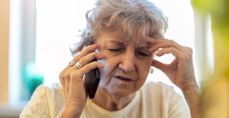 Older woman speaking on the phone