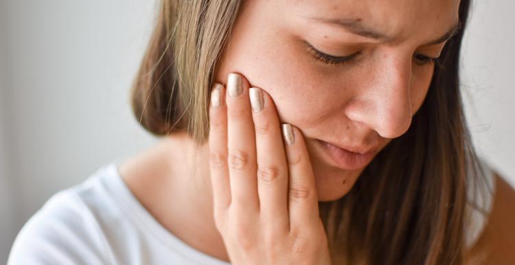 Young woman with toothache