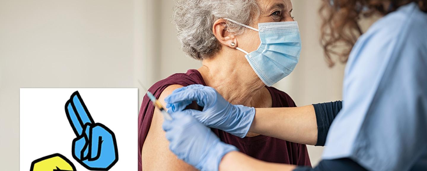 Older woman receiving a covid vaccination