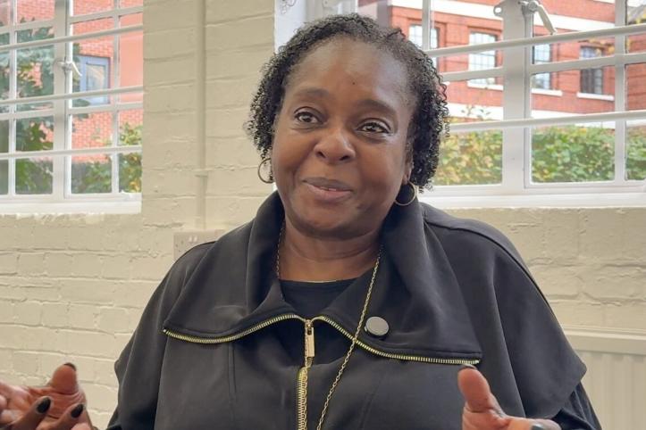 Director from Choices CIC sitting in front of a window