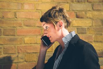 Woman listening on a mobile phone