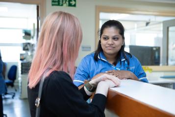 Woman talking to a female nurse