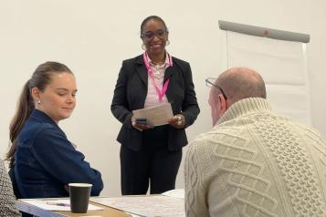 Professionals talking about ways to challenge inequality