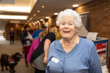 Smiling woman at a meeting