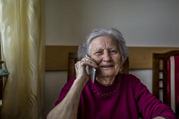 Elderly woman talking on the phone