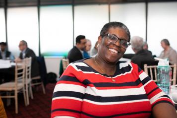 Smiling woman at a meeting