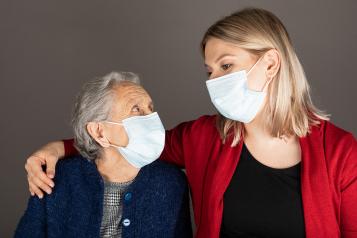 Elderly woman with caregiver