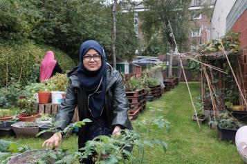 Bangladeshi woman enjoying gardening