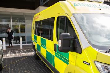 Hospital exterior with ambulance