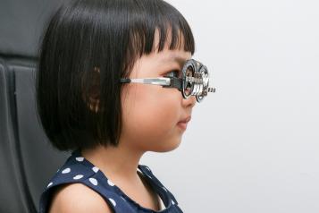 Young girl having an eye test