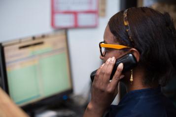 Woman looking at patient data on a computer