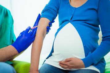 Pregnant woman receiving flu vaccination