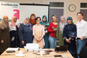 Trainers and participants at a smartphone training workshop