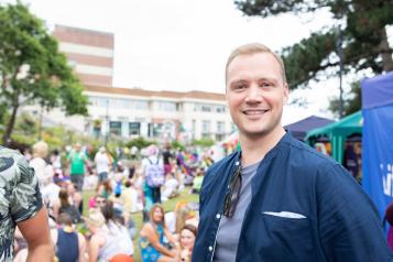 Smiling man at an outdoor event