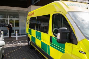 an ambulance parked outside a hospital