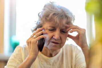 Older woman speaking on the phone