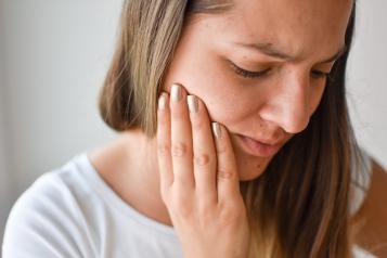 Young woman with toothache