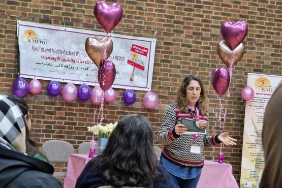 Gulum presenting to the Kurdish and Middle Eastern Women's Organisation