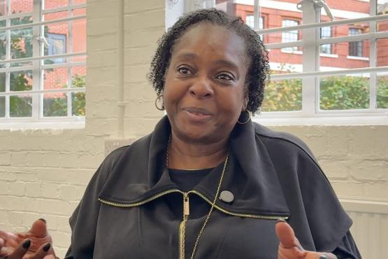 Director from Choices CIC sitting in front of a window